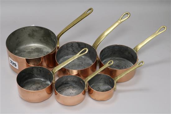 A set of 6 brass-handled copper graduated sauce pans Largest 12.5cm